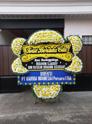 Papan Bunga Duka di Piani